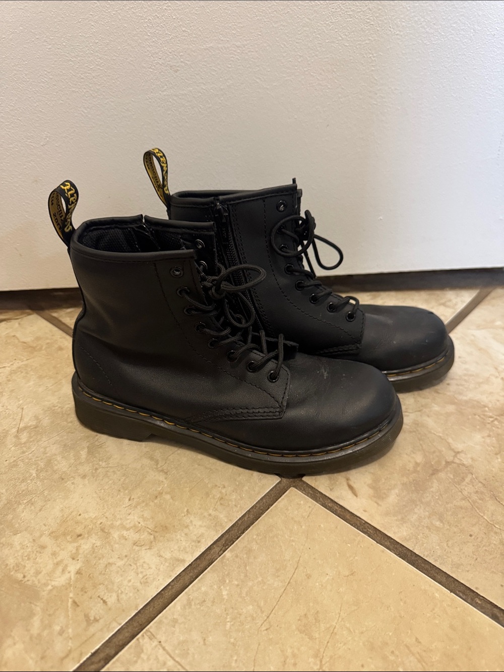 Dr. Martens Black Leather 8-Eye Lace-Up Combat Boots with Yellow Heel Loop